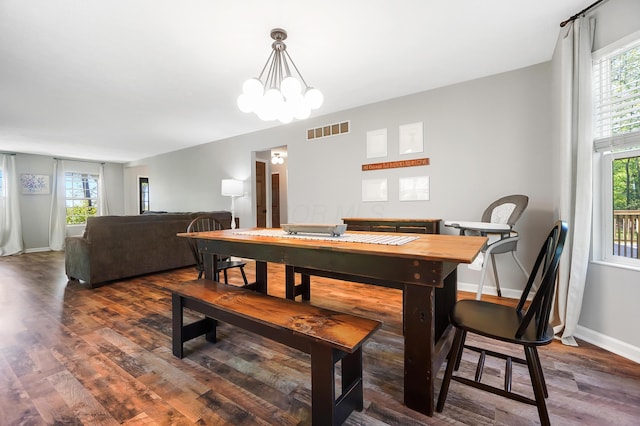 7353 Selma Pike, South Charleston, OH 45368 - dining space with plenty of natural light, wood finished floors, baseboards, and a chandelier