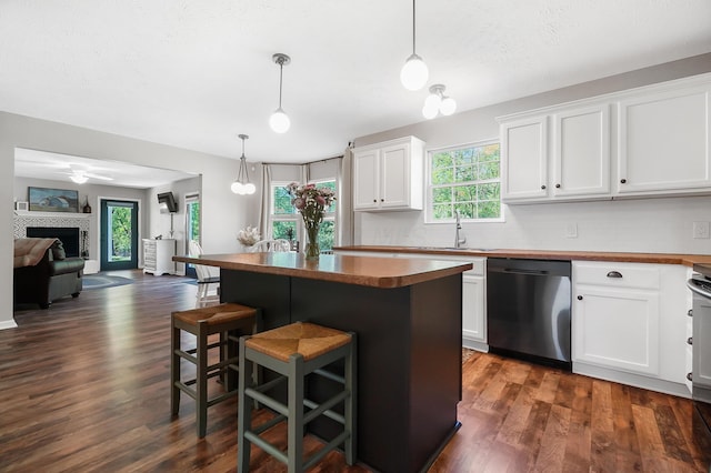 7353 Selma Pike, South Charleston, OH 45368 - kitchen with dishwasher, open floor plan, dark wood finished floors, white cabinetry, and a kitchen breakfast bar