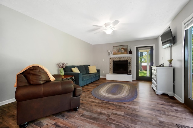 7353 Selma Pike, South Charleston, OH 45368 - living area with ceiling fan, plenty of natural light, a tile fireplace, and wood finished floors
