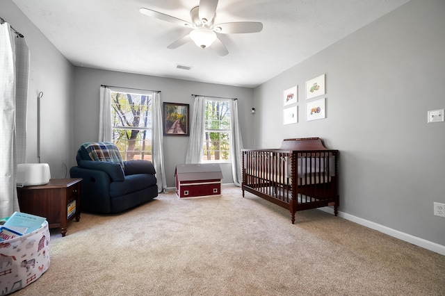 7353 Selma Pike, South Charleston, OH 45368 - bedroom with carpet, a crib, baseboards, and ceiling fan