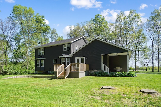 7353 Selma Pike, South Charleston, OH 45368 - rear view of house featuring a lawn, a deck, and stairs