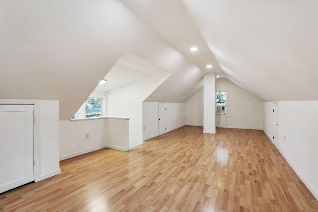 255 E Kelso Rd, Columbus, OH 43202 - additional living space with light wood-type flooring, lofted ceiling, baseboards, plenty of natural light, and recessed lighting