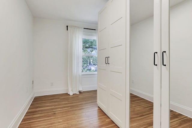 255 E Kelso Rd, Columbus, OH 43202 - unfurnished bedroom featuring light wood finished floors and baseboards