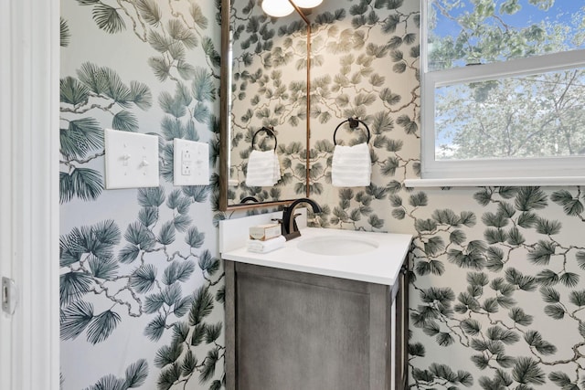 255 E Kelso Rd, Columbus, OH 43202 - bathroom featuring vanity, wallpapered walls, and healthy amount of natural light