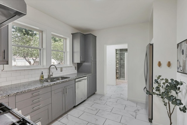 255 E Kelso Rd, Columbus, OH 43202 - kitchen with stainless steel appliances, a sink, gray cabinets, light marble finish flooring, and light stone countertops