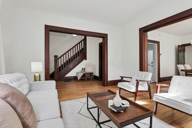 255 E Kelso Rd, Columbus, OH 43202 - living room featuring stairway, light wood-type flooring, and baseboards