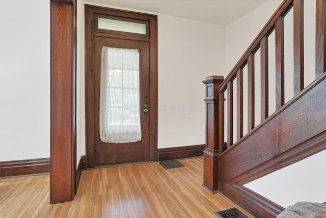 255 E Kelso Rd, Columbus, OH 43202 - foyer entrance featuring baseboards, wood finished floors, and stairway