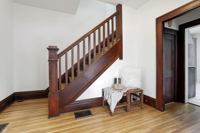 255 E Kelso Rd, Columbus, OH 43202 - staircase with baseboards and wood finished floors