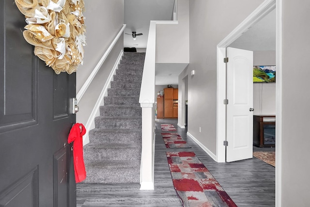 5617 Branchville Dr, Canal Winchester, OH 43110 - foyer entrance with wood finished floors, stairway, and baseboards