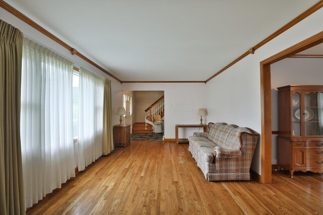 6070 Barberry Holw, Columbus, OH 43213 - sitting room featuring ornamental molding, light wood-style flooring, baseboards, and stairway