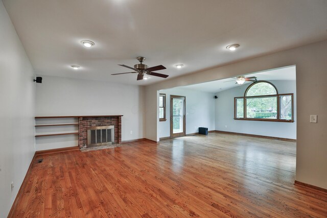 6070 Barberry Holw, Columbus, OH 43213 - unfurnished living room featuring a ceiling fan, light wood-type flooring, baseboards, and a fireplace