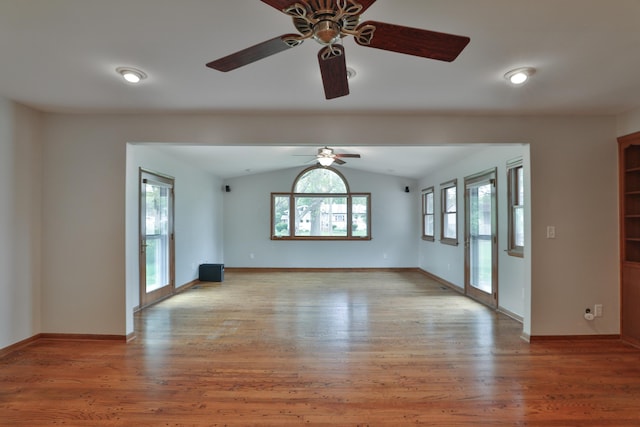 6070 Barberry Holw, Columbus, OH 43213 - unfurnished living room featuring a ceiling fan, vaulted ceiling, light wood finished floors, and baseboards
