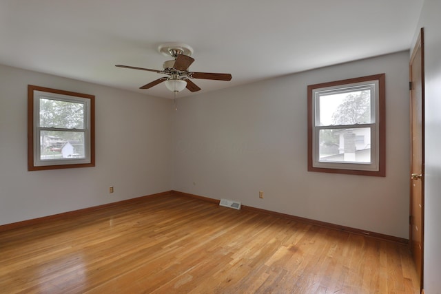 6070 Barberry Holw, Columbus, OH 43213 - unfurnished room with healthy amount of natural light, light wood-style flooring, ceiling fan, and baseboards