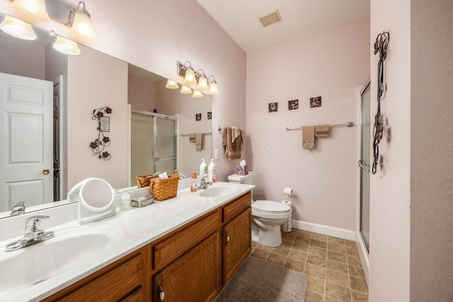 4 Claire Ct, Circleville, OH 43113 - bathroom with a shower stall, double vanity, toilet, and baseboards