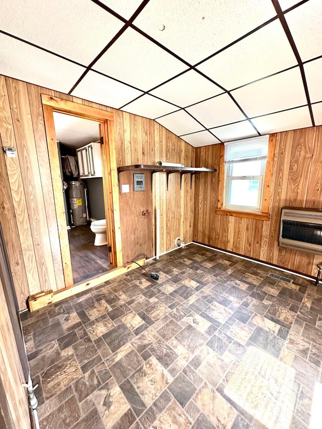 619 Sugar St, Marion, OH 43302 - bonus room featuring heating unit, wood walls, and water heater