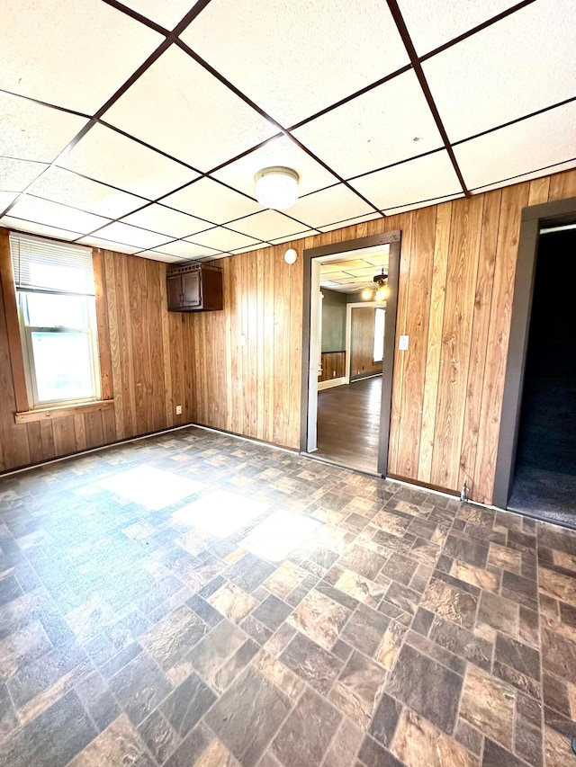 619 Sugar St, Marion, OH 43302 - unfurnished room featuring wooden walls, baseboards, and a paneled ceiling