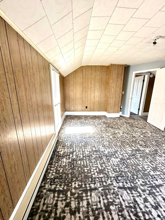 619 Sugar St, Marion, OH 43302 - spare room featuring wooden walls, baseboards, and vaulted ceiling