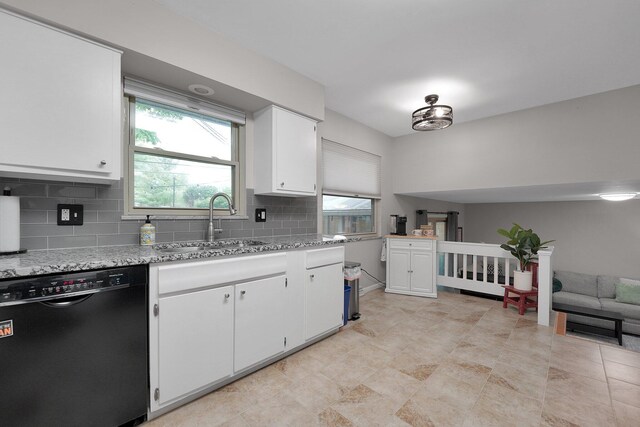 2711 Montcalm Rd, Columbus, OH 43221 - kitchen featuring dishwasher, a sink, backsplash, white cabinetry, and open floor plan