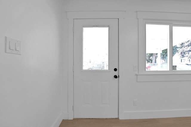 524 Avondale Ave, Marion, OH 43302 - doorway featuring healthy amount of natural light, light wood-type flooring, and baseboards