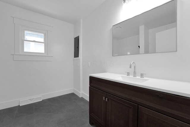 524 Avondale Ave, Marion, OH 43302 - bathroom featuring baseboards, vanity, and electric panel