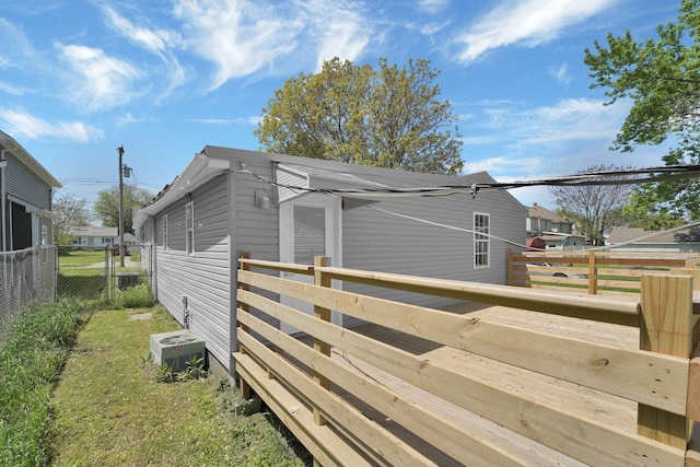 524 Avondale Ave, Marion, OH 43302 - view of home's exterior with central AC, fence, and a deck