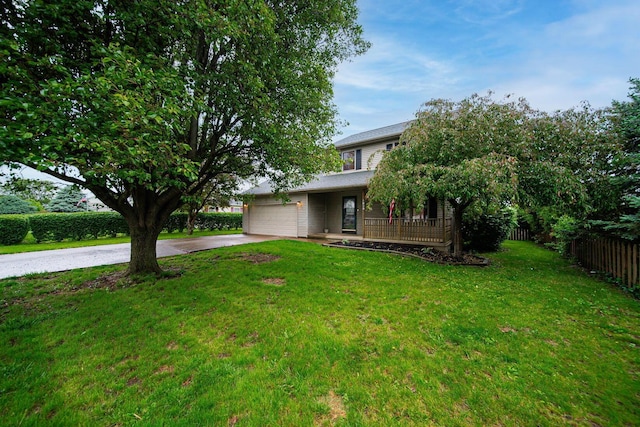 5039 Lee Rd, South Bloomfield, OH 43103 - obstructed view of property featuring concrete driveway, an attached garage, and a porch