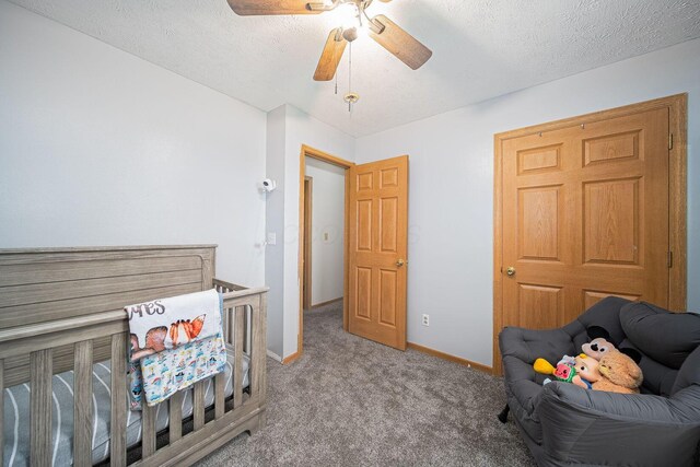 5039 Lee Rd, South Bloomfield, OH 43103 - living area featuring a ceiling fan, carpet flooring, baseboards, and a textured ceiling