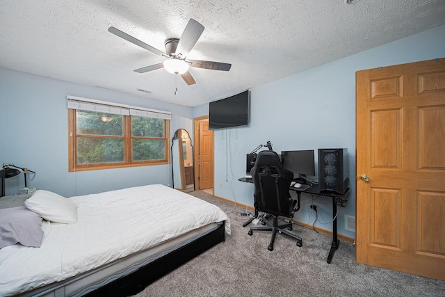 5039 Lee Rd, South Bloomfield, OH 43103 - carpeted bedroom with a textured ceiling and ceiling fan