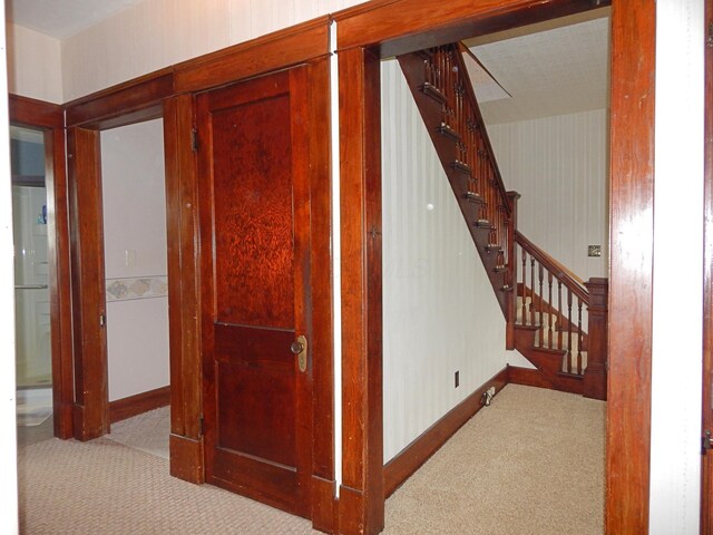 2705 County Road 118, Rushsylvania, OH 43347 - corridor featuring carpet, stairway, wallpapered walls, and baseboards