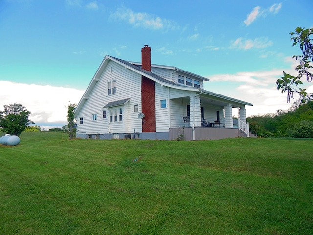 2705 County Road 118, Rushsylvania, OH 43347 - back of house with a chimney, a lawn, and a porch