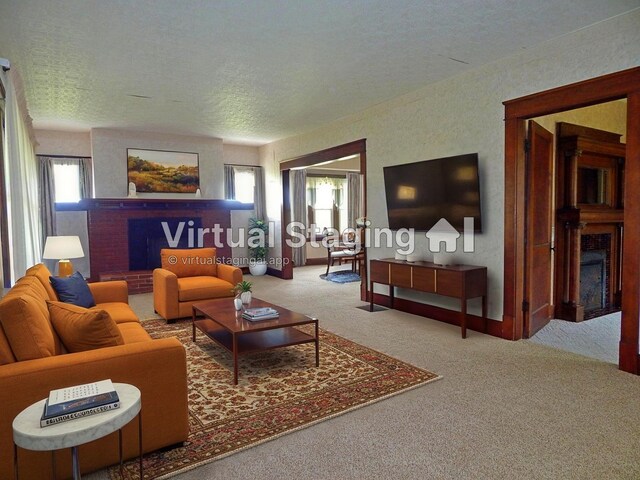 2705 County Road 118, Rushsylvania, OH 43347 - carpeted living area featuring a brick fireplace and a textured ceiling