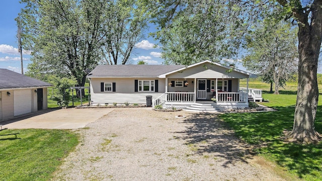 12955 State Route 188, Thornville, OH 43076 - view of front of property featuring a porch, a front yard, crawl space, and a garage