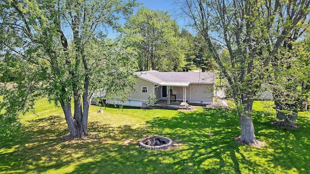 12955 State Route 188, Thornville, OH 43076 - back of property with a fire pit and a lawn