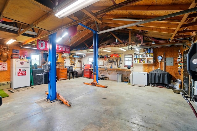 12955 State Route 188, Thornville, OH 43076 - garage featuring freestanding refrigerator and a workshop area
