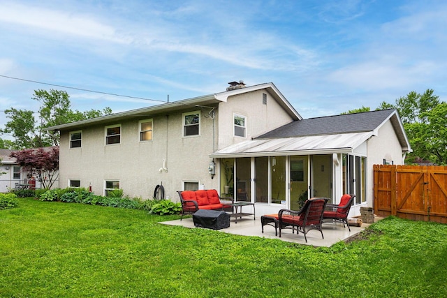 rear view of property featuring stucco siding, a patio, a sunroom, and outdoor lounge area