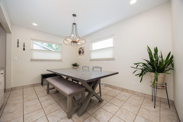 dining space with a chandelier, recessed lighting, light tile patterned floors, and baseboards