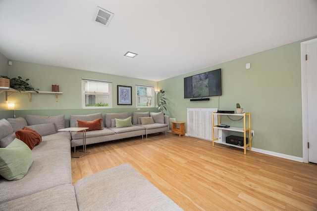 living area featuring wood finished floors and baseboards