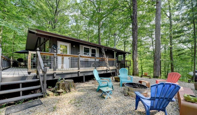1160 Flathead Ln, Sugar Grove, OH 43155 - rear view of property with an outdoor fire pit and a wooden deck