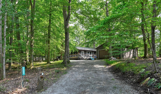 1160 Flathead Ln, Sugar Grove, OH 43155 - obstructed view of property featuring an outbuilding, a garage, and gravel driveway