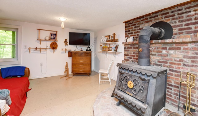 1160 Flathead Ln, Sugar Grove, OH 43155 - living area featuring a textured ceiling and a wood stove