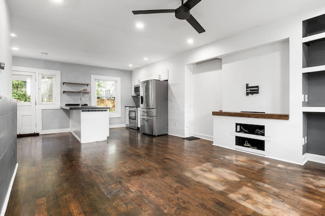 1369 Meadow Rd, Columbus, OH 43212 - unfurnished living room featuring a ceiling fan, a fireplace, dark wood-type flooring, baseboards, and recessed lighting