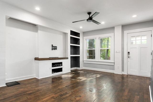 1369 Meadow Rd, Columbus, OH 43212 - unfurnished living room with a ceiling fan, a fireplace, hardwood / wood-style floors, built in shelves, and baseboards