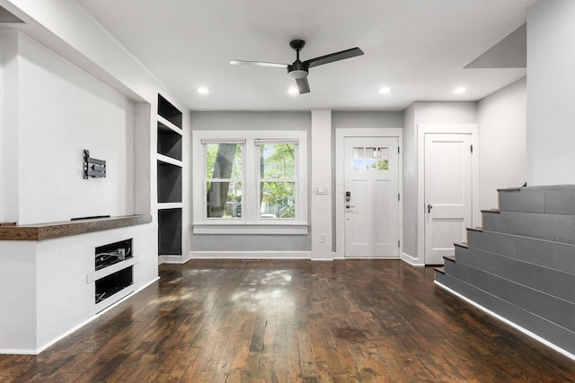 1369 Meadow Rd, Columbus, OH 43212 - entrance foyer with ceiling fan, a fireplace, wood-type flooring, baseboards, and stairway