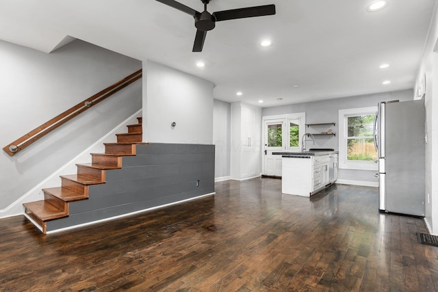 1369 Meadow Rd, Columbus, OH 43212 - unfurnished living room featuring a ceiling fan, dark wood-style flooring, stairway, recessed lighting, and baseboards