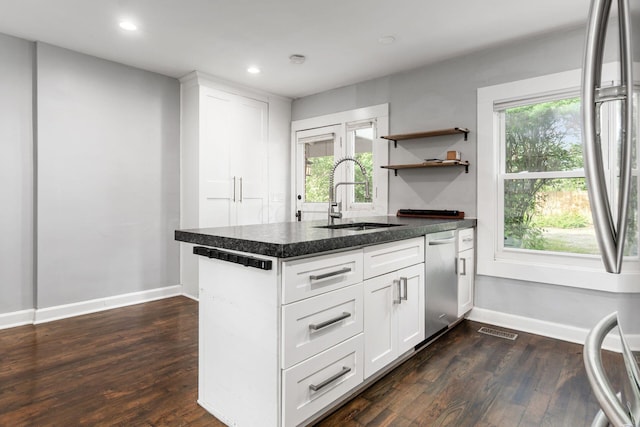 1369 Meadow Rd, Columbus, OH 43212 - kitchen with a sink, dishwasher, dark wood-style flooring, baseboards, and healthy amount of natural light