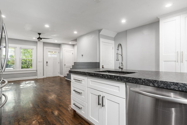 1369 Meadow Rd, Columbus, OH 43212 - kitchen with dishwasher, a sink, dark wood-style floors, recessed lighting, and white cabinets