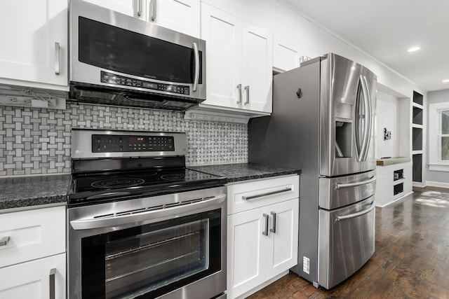 1369 Meadow Rd, Columbus, OH 43212 - kitchen featuring stainless steel appliances, white cabinets, decorative backsplash, dark wood-style flooring, and recessed lighting
