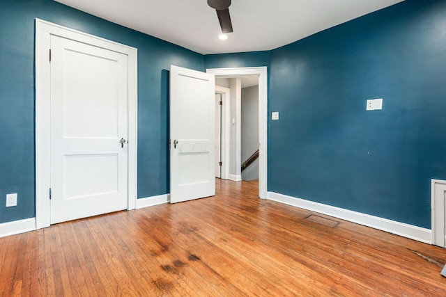 1369 Meadow Rd, Columbus, OH 43212 - unfurnished bedroom featuring baseboards, wood finished floors, and ceiling fan