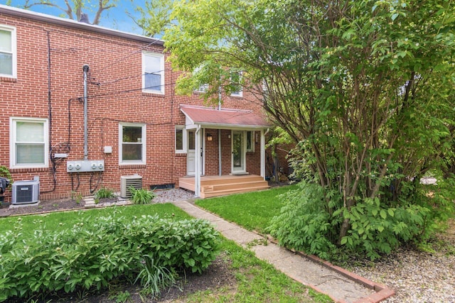 1369 Meadow Rd, Columbus, OH 43212 - view of front of property featuring brick siding, cooling unit, and a front yard