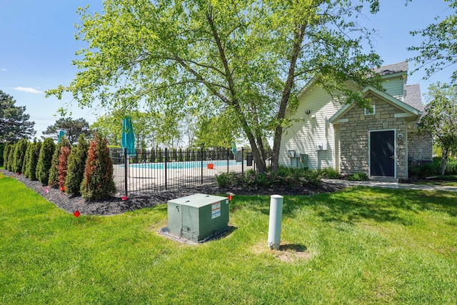 view of yard with a community pool
